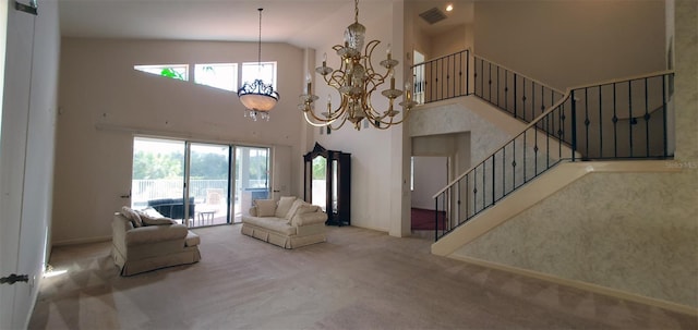 7279 Maidencane Ct, Seminole, FL 33777 - living area with visible vents, carpet, stairs, an inviting chandelier, and a towering ceiling