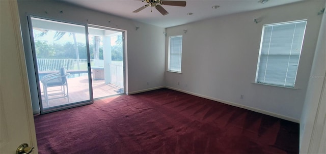 7279 Maidencane Ct, Seminole, FL 33777 - unfurnished room featuring carpet flooring, baseboards, and a ceiling fan