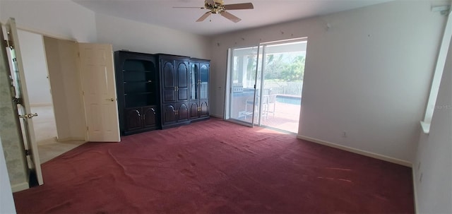 7279 Maidencane Ct, Seminole, FL 33777 - unfurnished bedroom featuring carpet flooring, a ceiling fan, baseboards, and access to outside