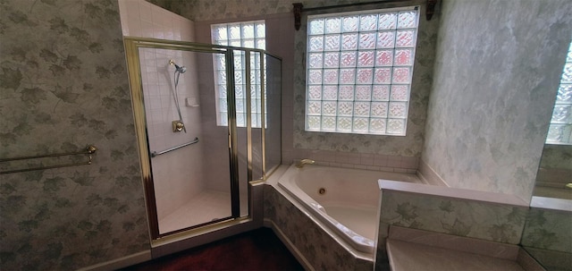 7279 Maidencane Ct, Seminole, FL 33777 - full bath with a tub with jets, a stall shower, and wallpapered walls