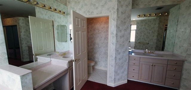 7279 Maidencane Ct, Seminole, FL 33777 - full bath with visible vents, toilet, wallpapered walls, tile patterned flooring, and vanity