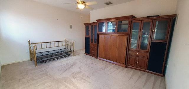 7279 Maidencane Ct, Seminole, FL 33777 - bedroom with light carpet, visible vents, and baseboards