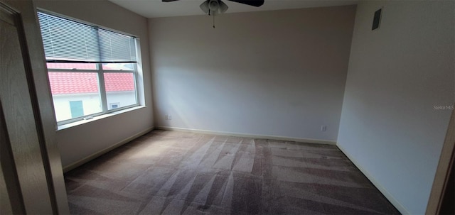 7279 Maidencane Ct, Seminole, FL 33777 - carpeted spare room featuring baseboards and ceiling fan
