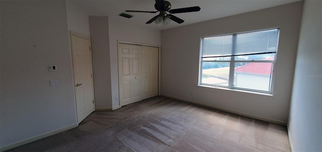 7279 Maidencane Ct, Seminole, FL 33777 - unfurnished bedroom with visible vents, a ceiling fan, a closet, carpet, and baseboards