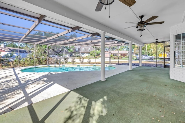 outdoor pool with ceiling fan, a lanai, and a patio area