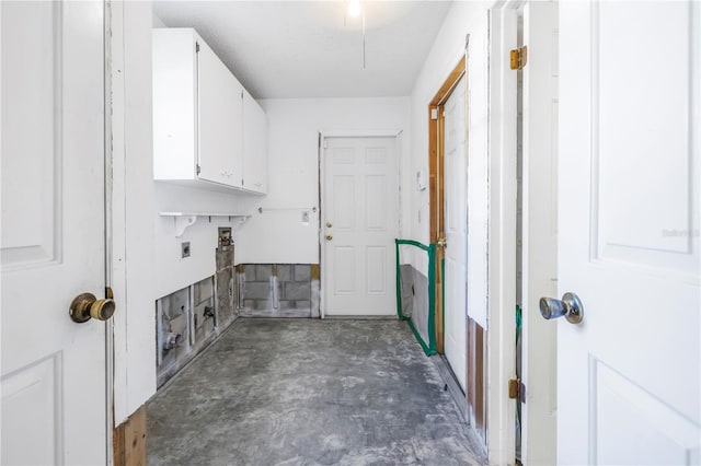 clothes washing area with cabinet space, hookup for an electric dryer, and washer hookup