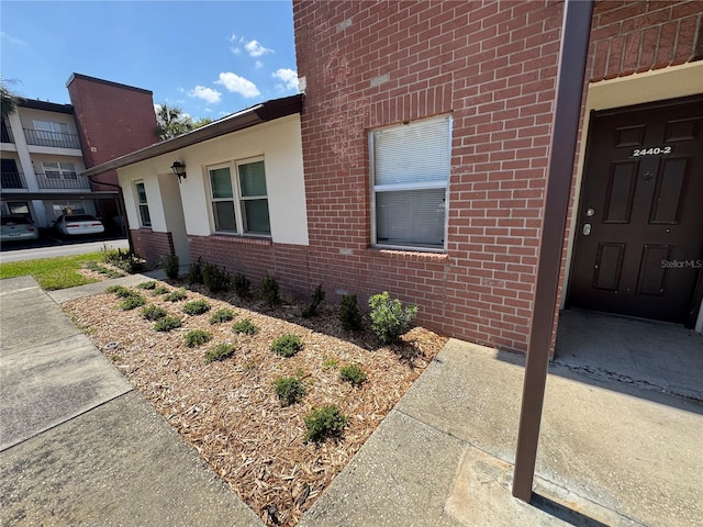 view of side of property with brick siding