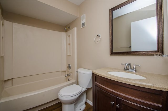 bathroom featuring visible vents, toilet, wood finished floors, bathtub / shower combination, and vanity