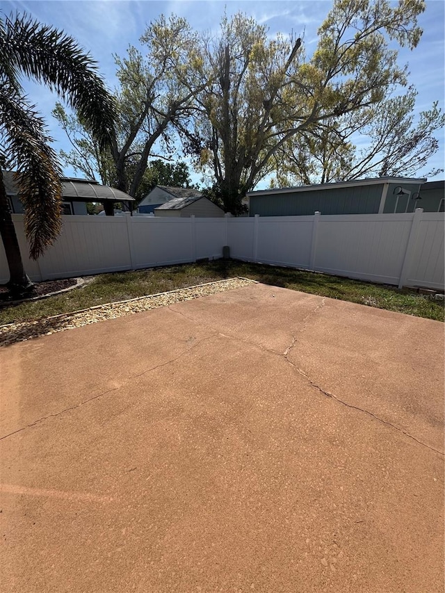 view of yard with a patio area and a fenced backyard