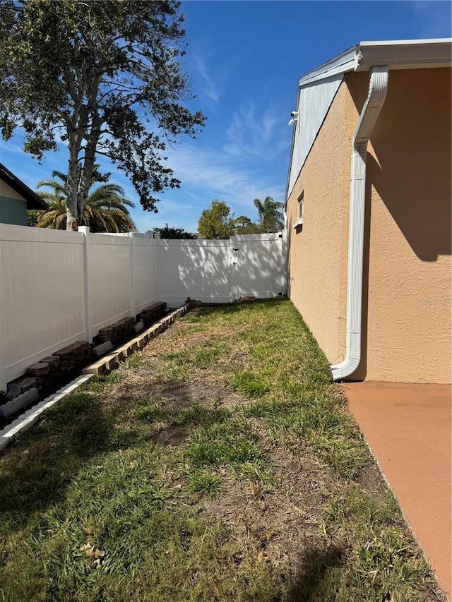 view of yard with a fenced backyard