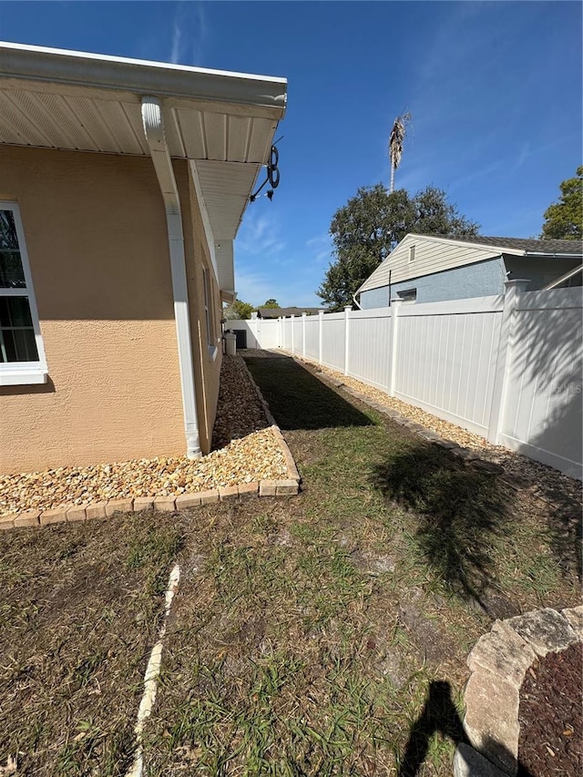 view of yard with a fenced backyard