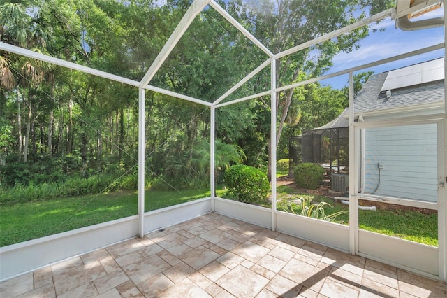 5014 Sterling Manor Dr, Tampa, FL 33647 - unfurnished sunroom featuring view of scattered trees