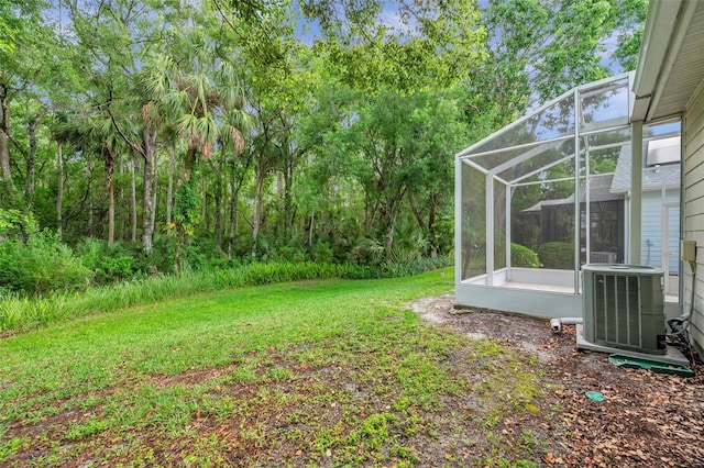 5014 Sterling Manor Dr, Tampa, FL 33647 - view of green lawn with central AC unit and glass enclosure