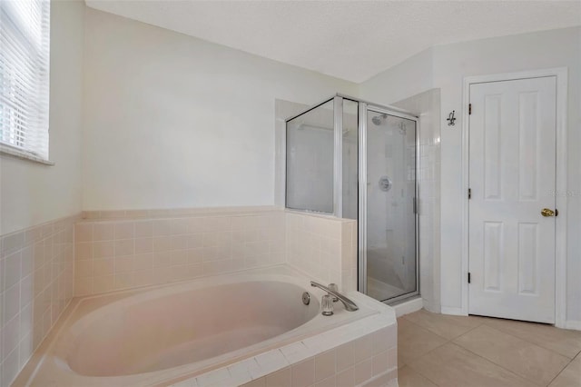 5014 Sterling Manor Dr, Tampa, FL 33647 - bathroom with a garden tub, a shower stall, and tile patterned flooring