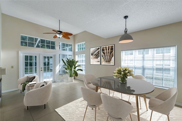 5014 Sterling Manor Dr, Tampa, FL 33647 - tiled dining room featuring ceiling fan, baseboards, french doors, and a textured ceiling