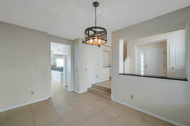 5014 Sterling Manor Dr, Tampa, FL 33647 - empty room with baseboards and light tile patterned floors
