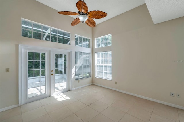5014 Sterling Manor Dr, Tampa, FL 33647 - unfurnished room with french doors, tile patterned flooring, baseboards, and ceiling fan