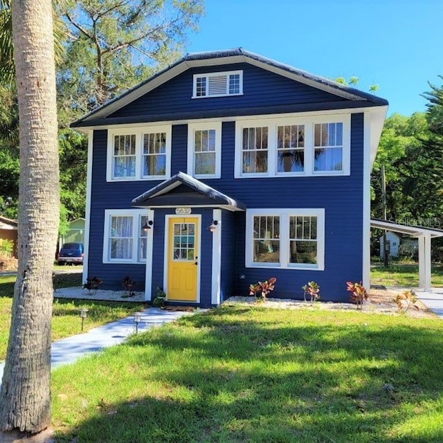 view of front of home with a front lawn