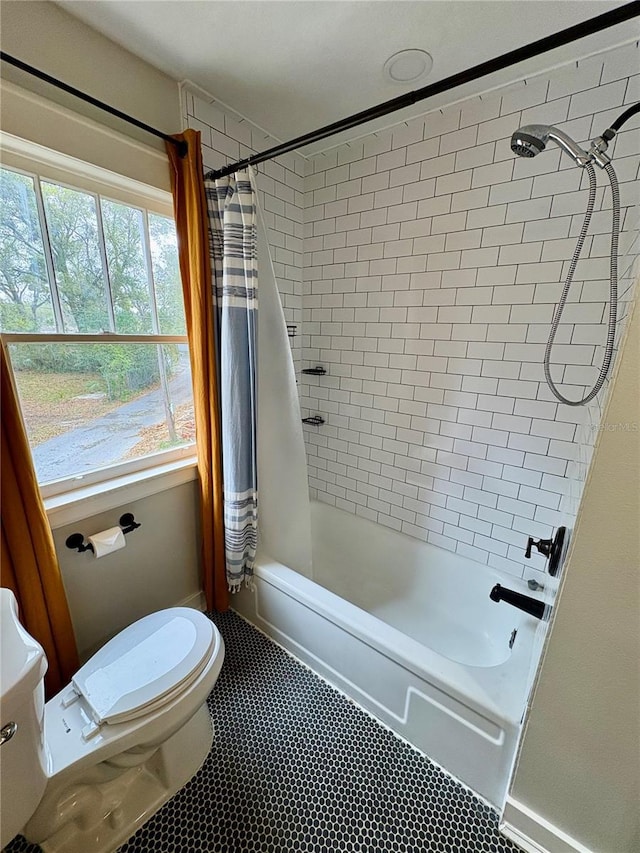 full bathroom with toilet and shower / bath combo