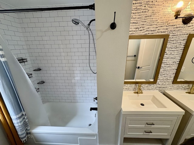 bathroom with backsplash, shower / bath combo, and vanity