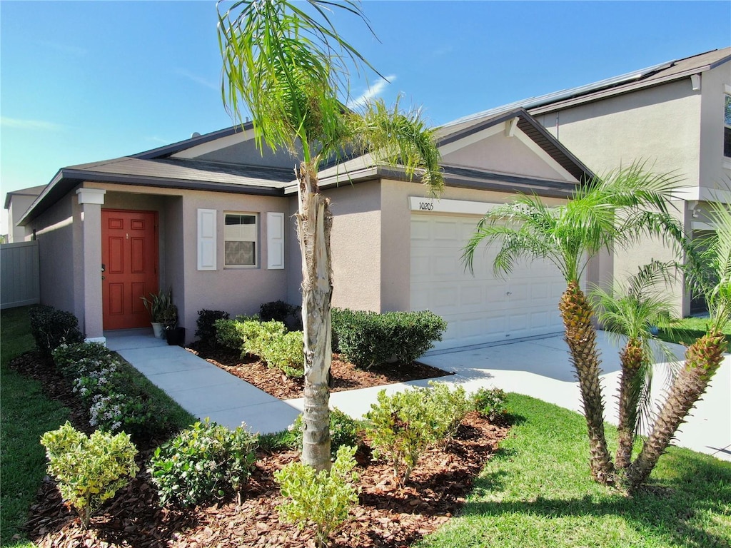 10205 Cool Waterlily Ave, Riverview, FL 33578 - view of front facade featuring a garage, driveway, and stucco siding
