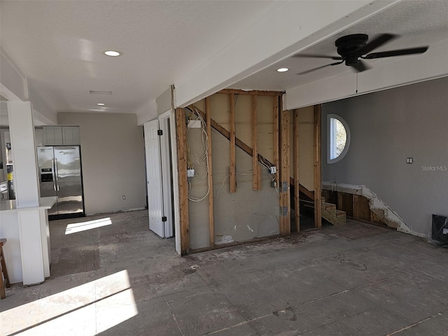 interior space featuring ceiling fan