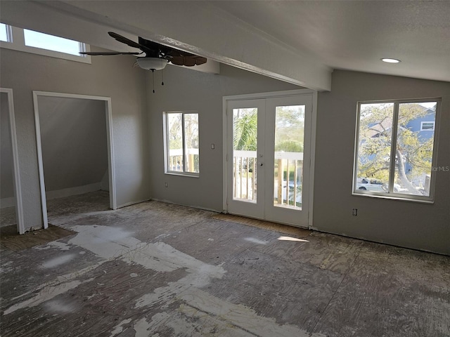 interior space with lofted ceiling, french doors, a wealth of natural light, and ceiling fan