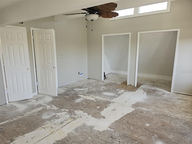 unfurnished bedroom featuring two closets and ceiling fan