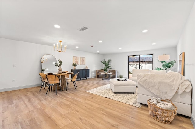 living room with recessed lighting, visible vents, an inviting chandelier, and light wood-style flooring