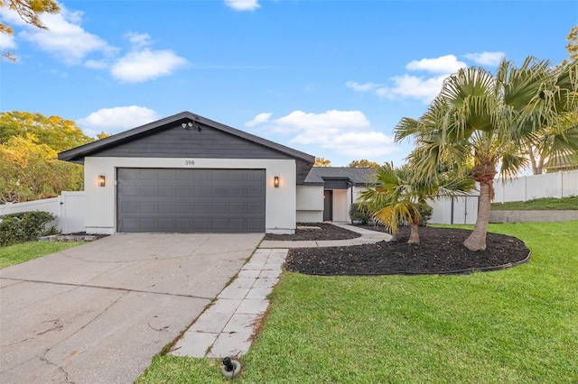 ranch-style home featuring stucco siding, driveway, fence, a front yard, and a garage