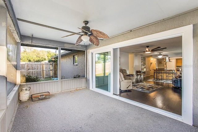 sunroom with a ceiling fan