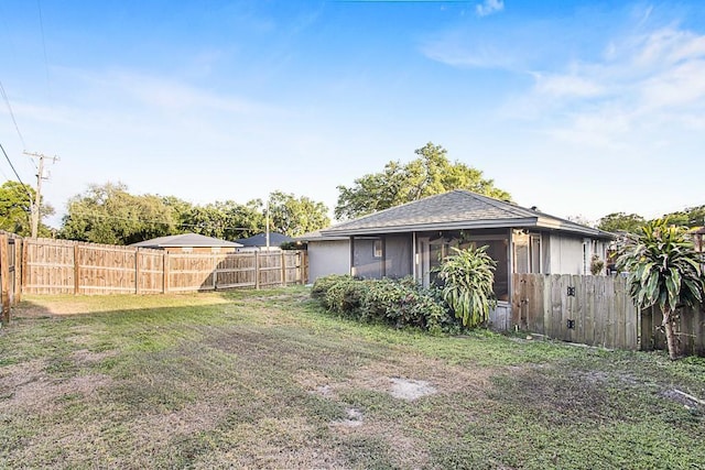 view of yard with a fenced backyard