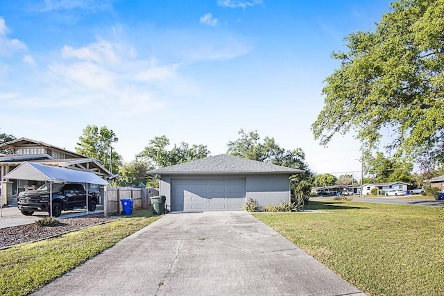 view of side of property featuring a yard, a garage, and fence