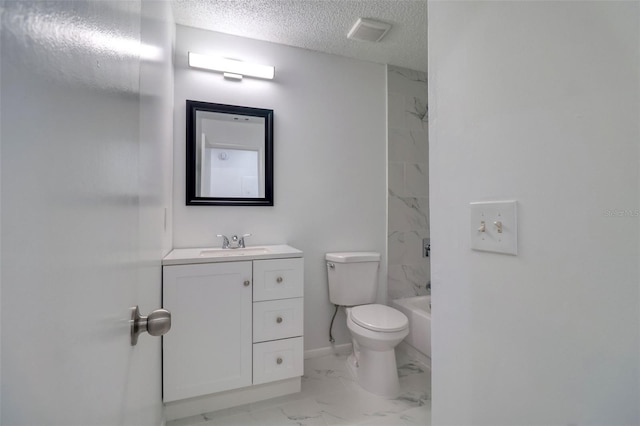 bathroom featuring toilet, marble finish floor, a textured ceiling, baseboards, and vanity