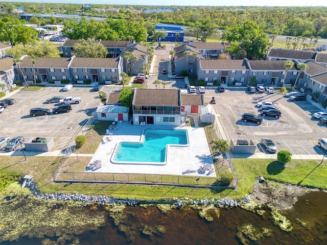 bird's eye view featuring a residential view and a water view