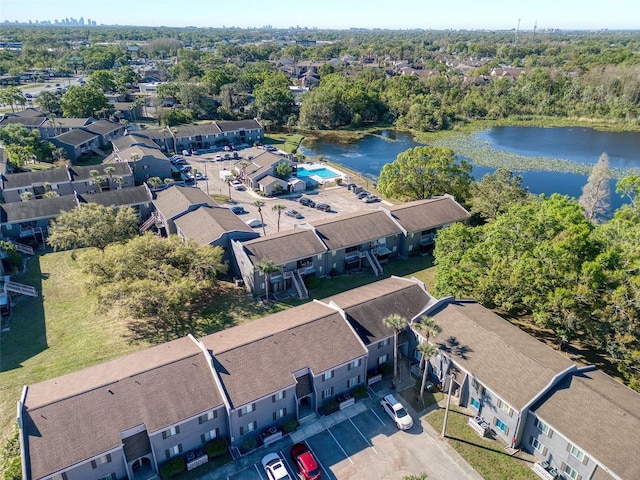 drone / aerial view featuring a residential view and a water view