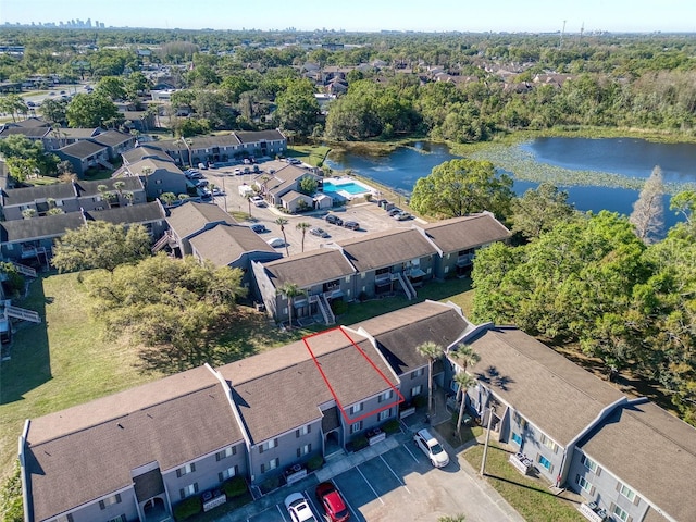 drone / aerial view with a residential view and a water view