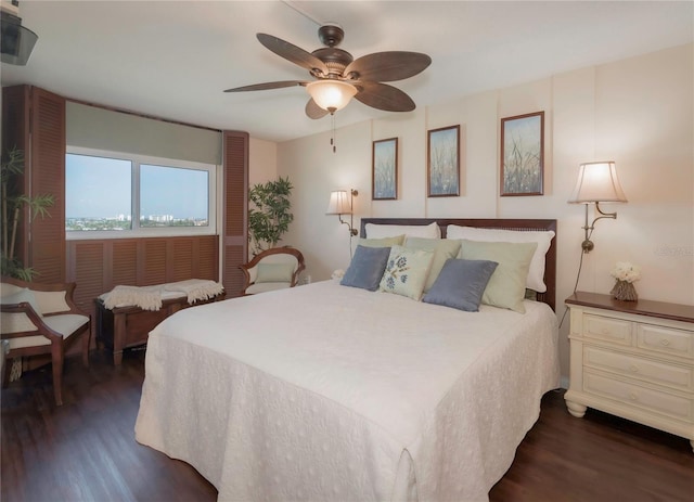 bedroom featuring ceiling fan and dark wood finished floors