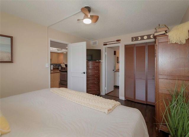 bedroom featuring a closet and dark wood finished floors