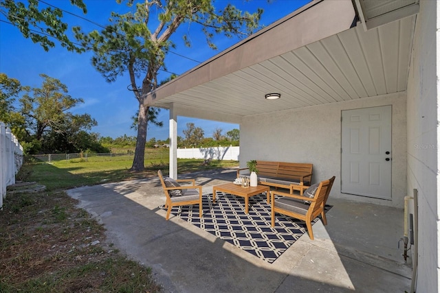 view of patio / terrace featuring fence