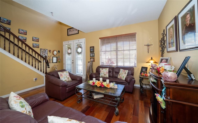 living room with stairway, baseboards, and wood finished floors