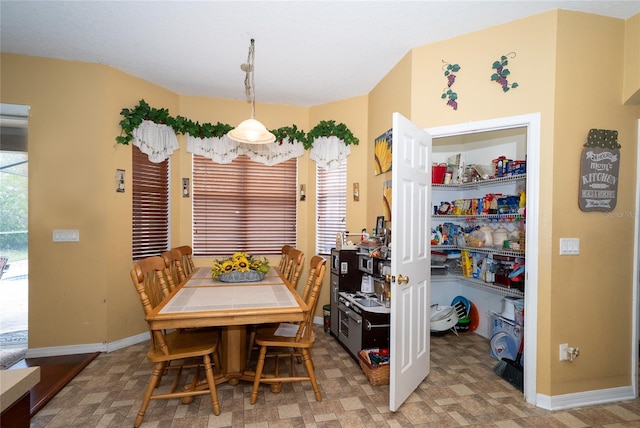 dining space with baseboards