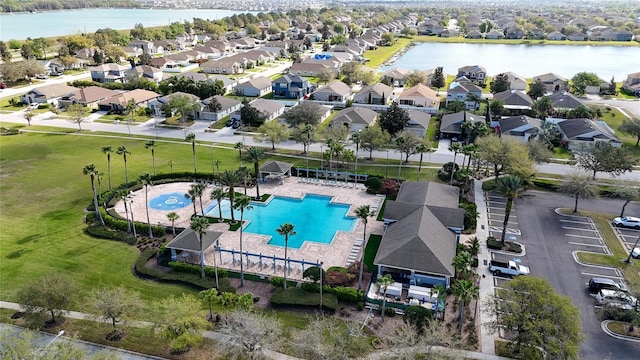 aerial view featuring a residential view and a water view