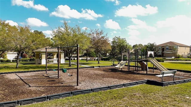 community jungle gym featuring a yard