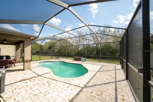 pool featuring a patio, a lanai, and ceiling fan