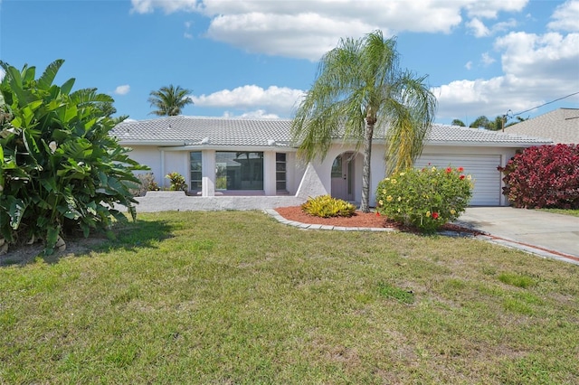 ranch-style house featuring stucco siding, an attached garage, a tile roof, and a front lawn