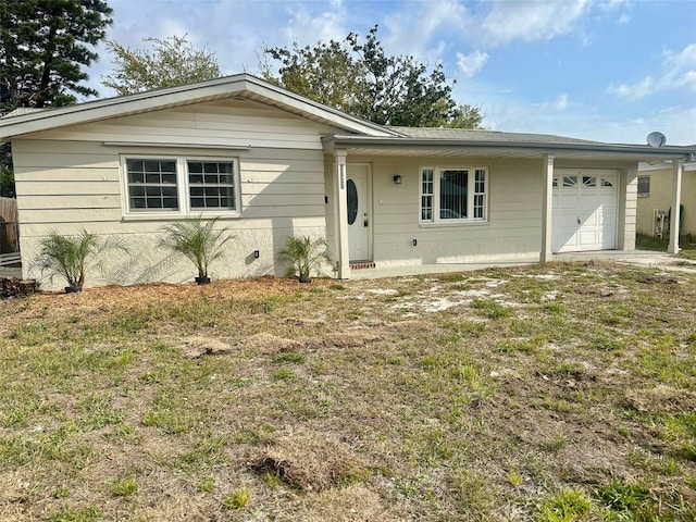 ranch-style house featuring an attached garage