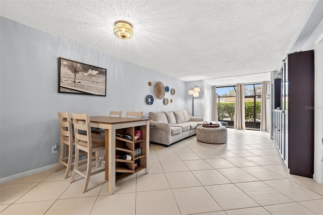 1986 Pelican Landing Blvd Unit 1514, Clearwater, FL 33762 - living room with tile patterned floors, baseboards, and a textured ceiling