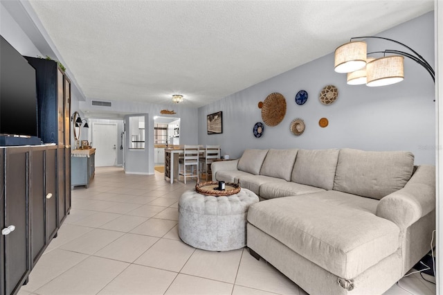 1986 Pelican Landing Blvd Unit 1514, Clearwater, FL 33762 - living room with light tile patterned floors, visible vents, and a textured ceiling