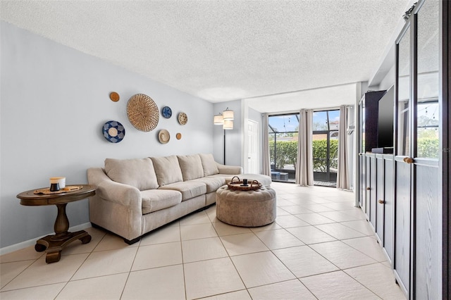 1986 Pelican Landing Blvd Unit 1514, Clearwater, FL 33762 - living area with light tile patterned floors, a textured ceiling, and baseboards
